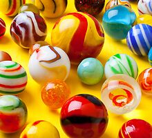 Lots of colorful marbles by Garry Gay