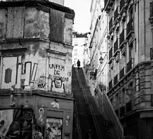 Woman reaching the top of the stairs (Montmartre, Paris) by Olivier Sohn