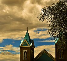 I saw the crosses so often — and often in unexpected places — like a thin dark veil of the Catholic church spread over the New Mexico landscape by James Edward Creamer