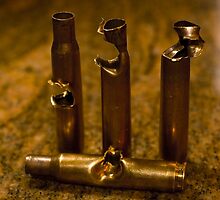 .30 Caliber shells, hit by .30 Caliber Bullets by Collin Dow