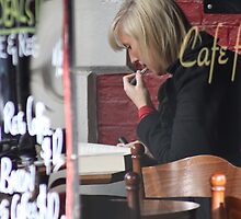 Refreshing her lipstick, while reading a book ... by Ell-on-Wheels